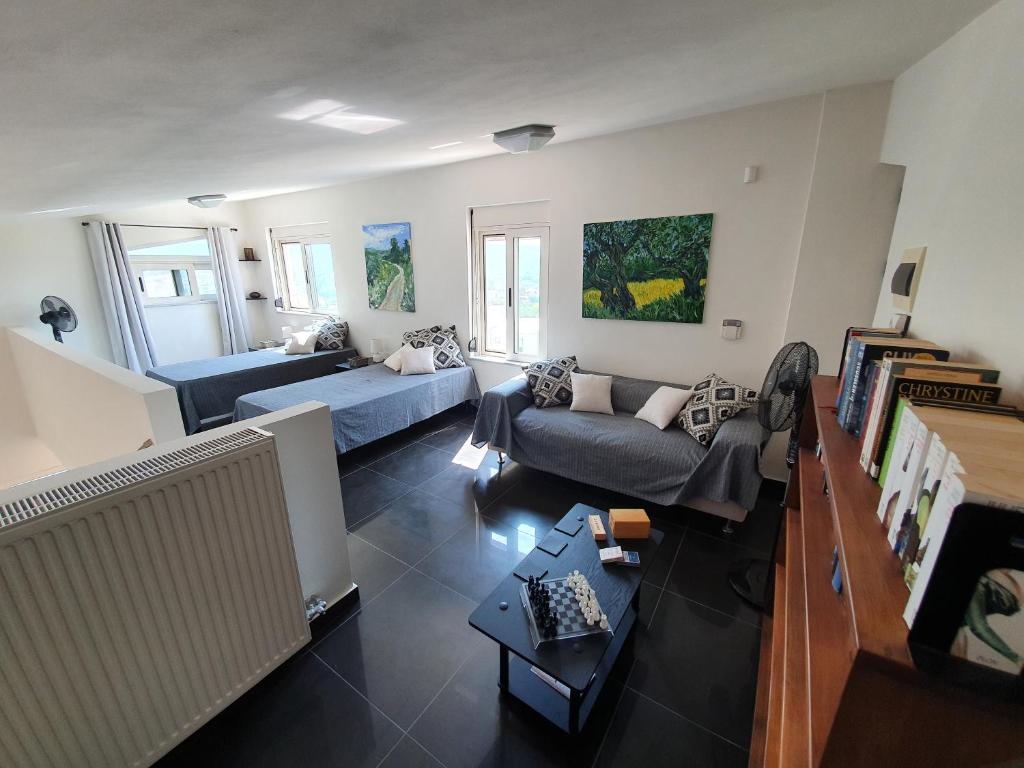 A bed or beds in a room at Argo Villa Kalives