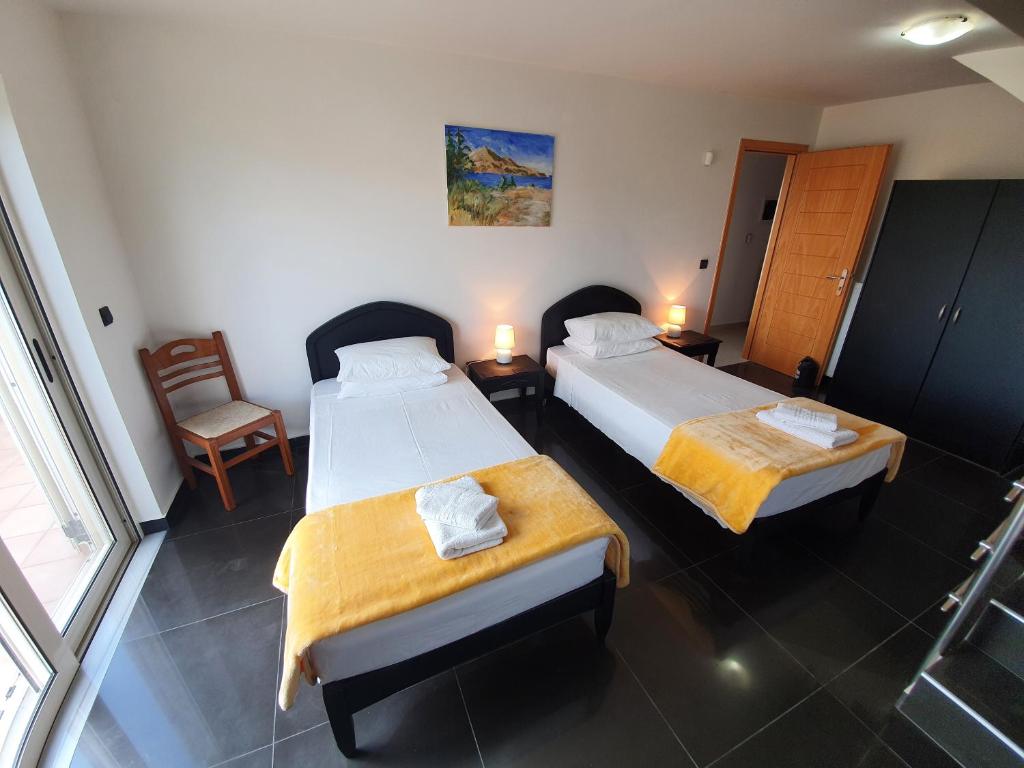 A bed or beds in a room at Argo Villa Kalives
