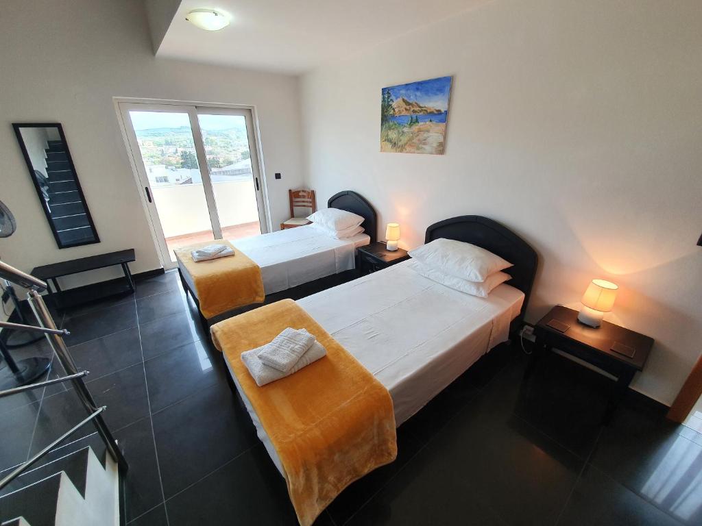 A bed or beds in a room at Argo Villa Kalives
