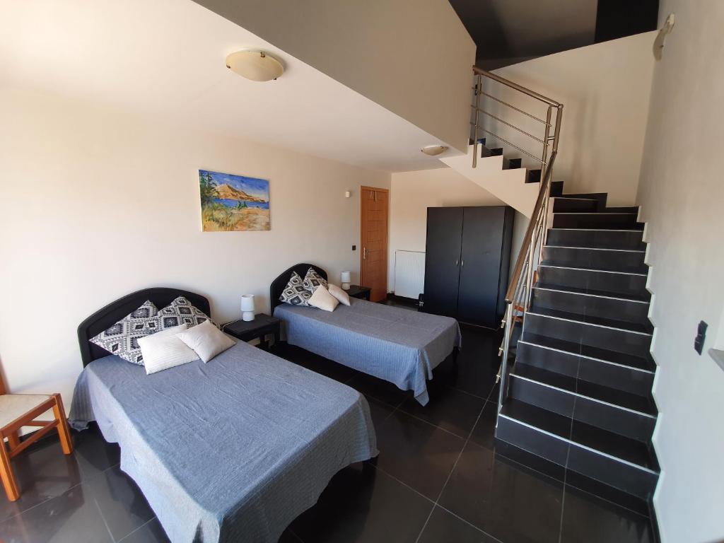 A bed or beds in a room at Argo Villa Kalives