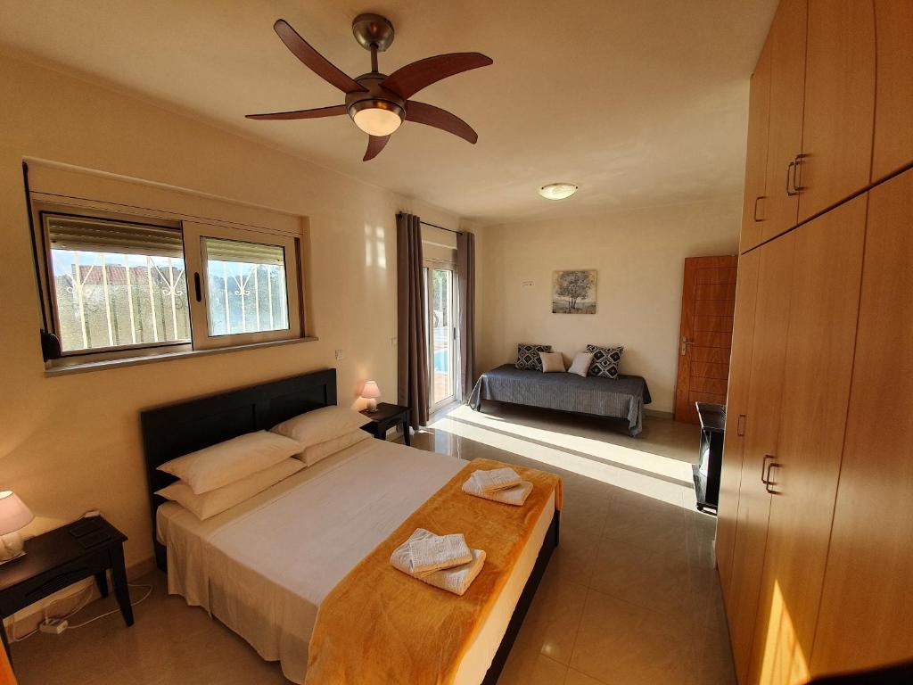 A bed or beds in a room at Argo Villa Kalives