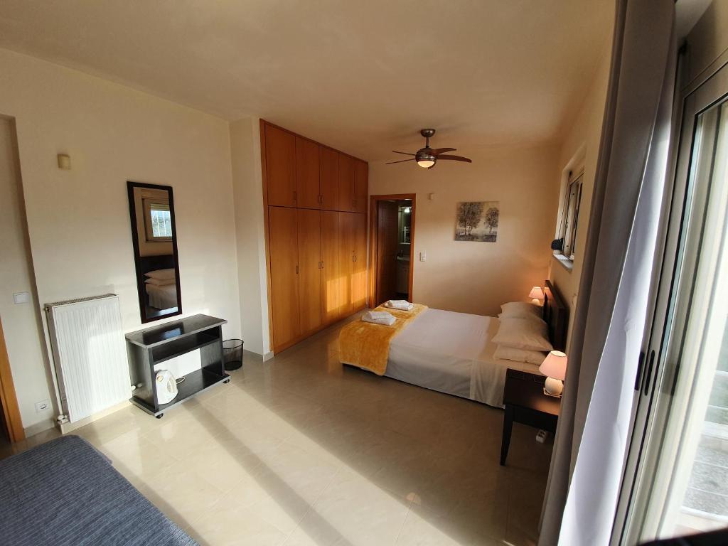 A bed or beds in a room at Argo Villa Kalives