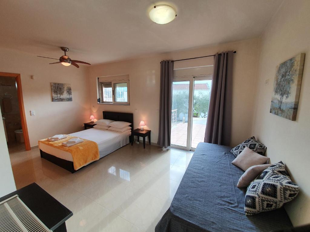 A bed or beds in a room at Argo Villa Kalives