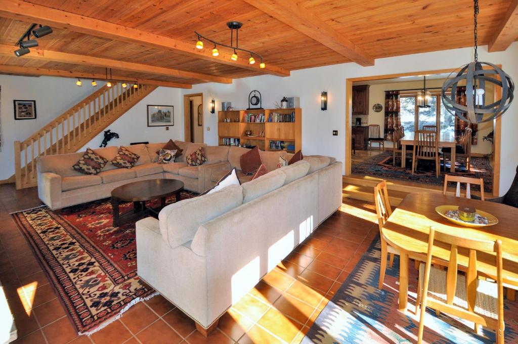 a living room with a couch and a table at Cascade Village Area 5 bed 4 bath, Walk to lift! in Vail