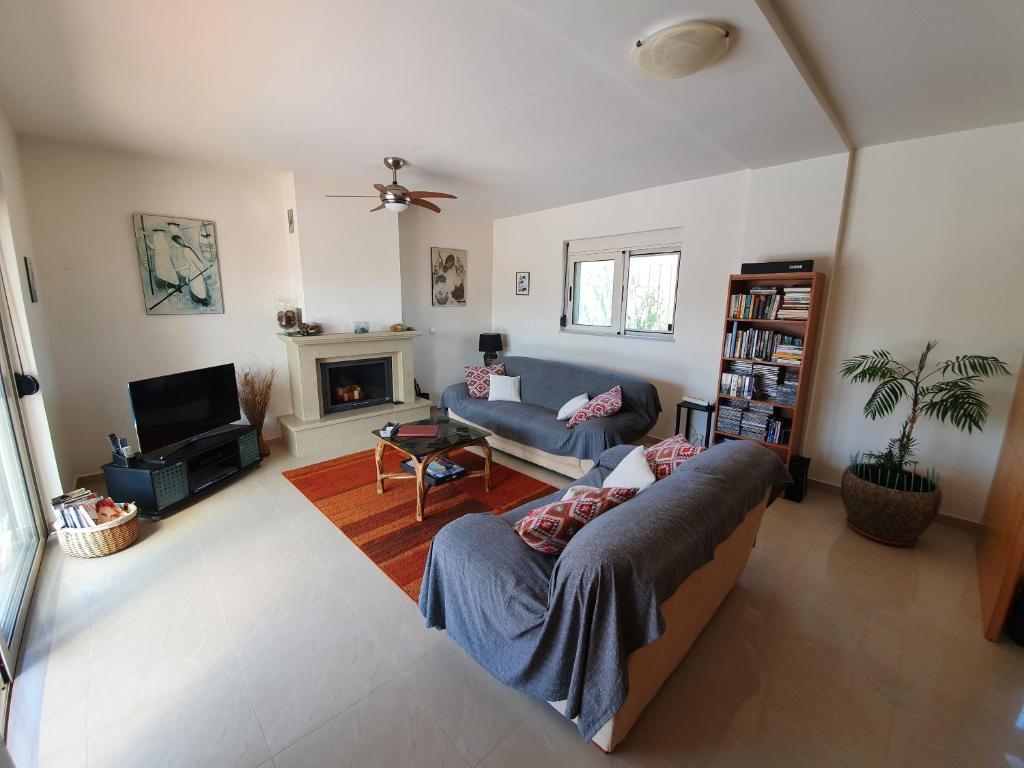 A television and/or entertainment centre at Argo Villa Kalives