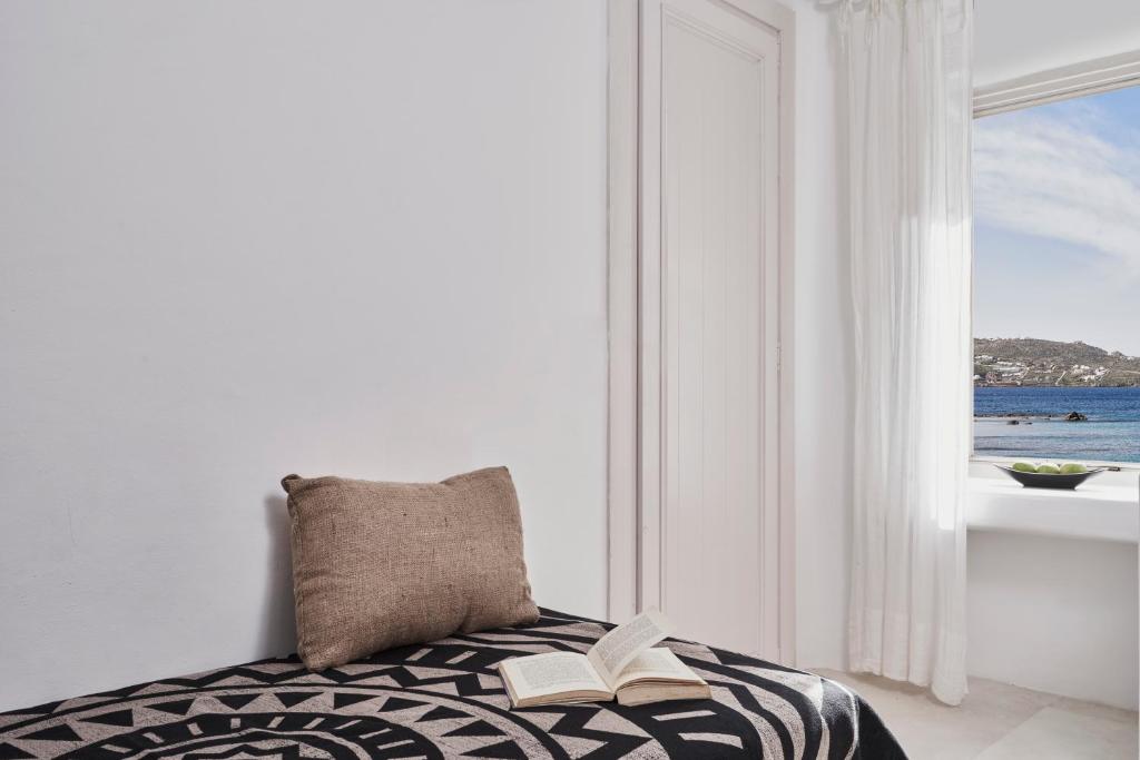 A bed or beds in a room at Little Venice Suites