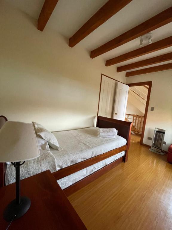 Postel nebo postele na pokoji v ubytování Apart Hotel Sol y Lago