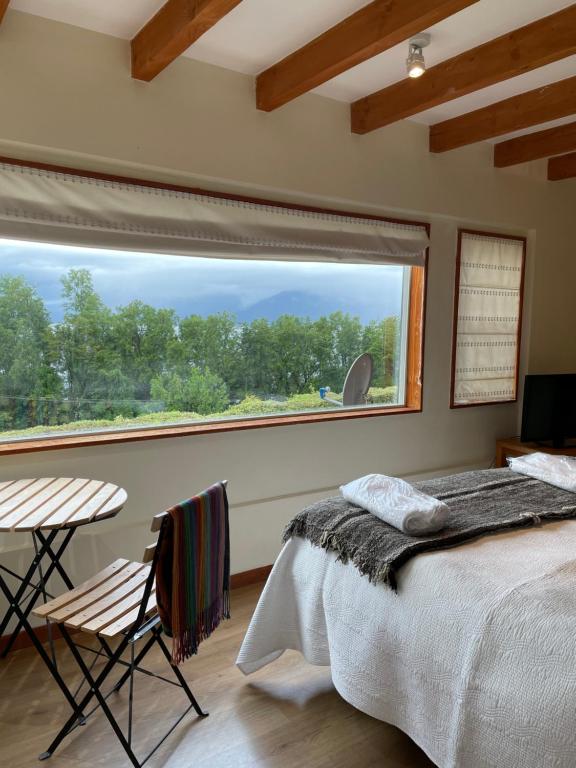 Postel nebo postele na pokoji v ubytování Apart Hotel Sol y Lago