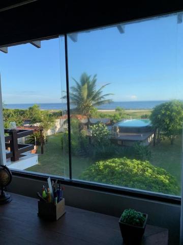  CASA EM FRENTE À PRAIA DE ITAÚNA