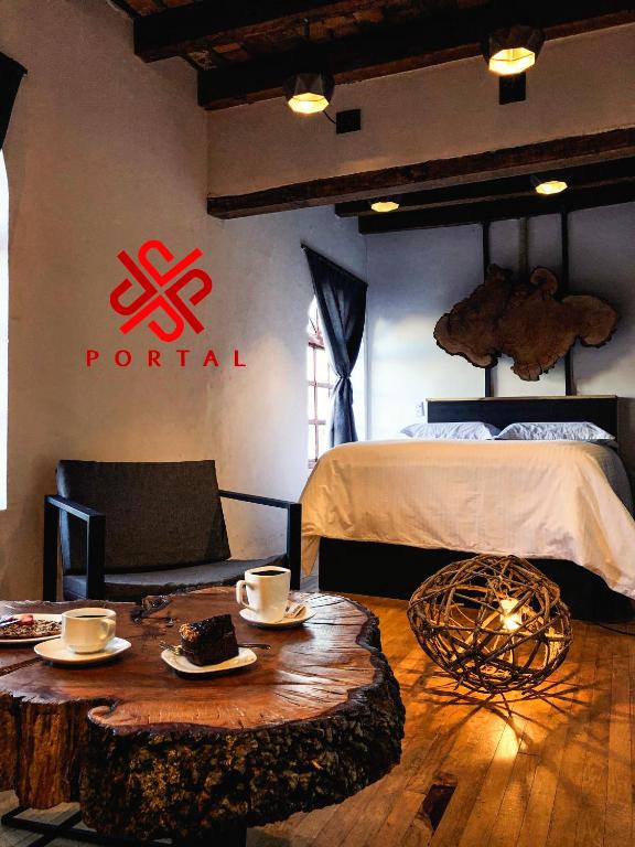 Postel nebo postele na pokoji v ubytování Hotel Portal & Suites