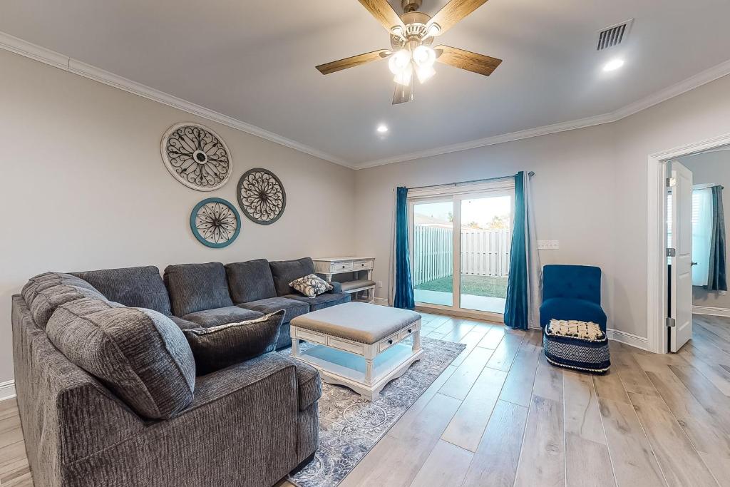 a living room with a couch and a table at Cotton Creek #1102 in Gulf Shores