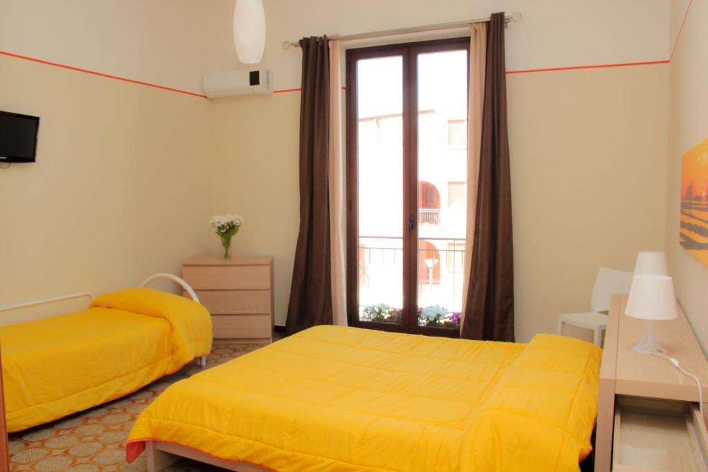 Postel nebo postele na pokoji v ubytování B&B Cafisu