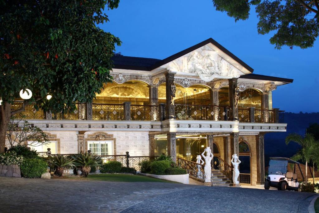 a large house with akritkritkritkritkritkritkritkritkritkritkrit at Rancho Bernardo Luxury Villas and Resort in Bagac