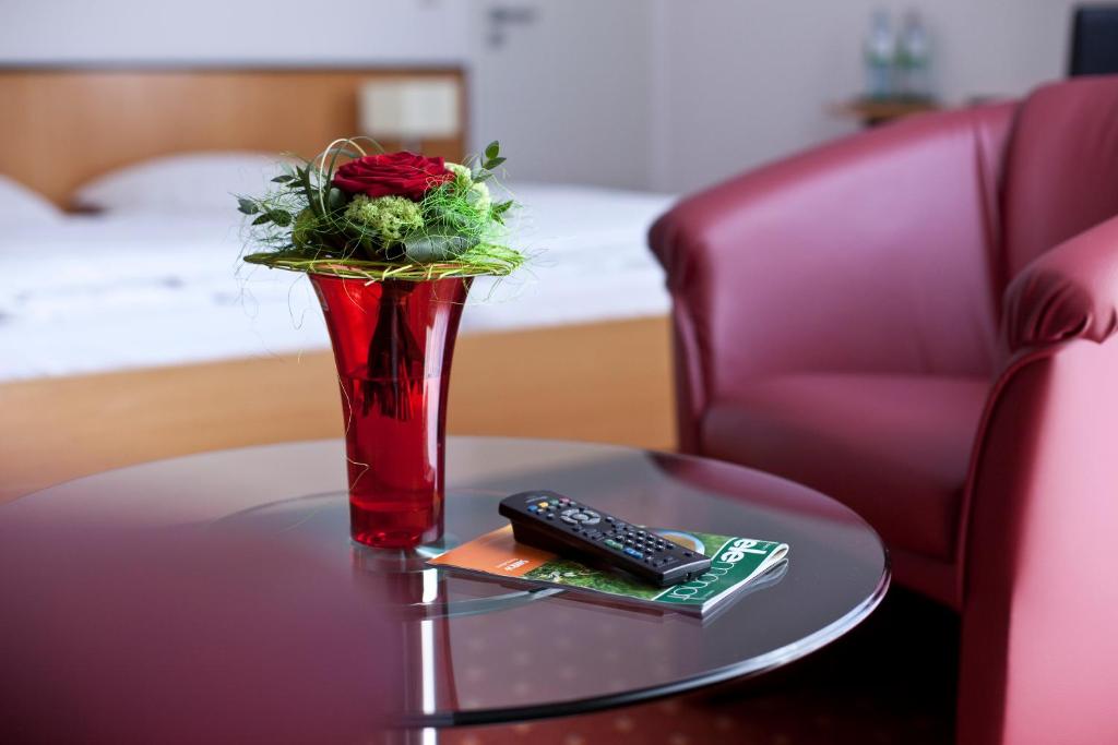 Postel nebo postele na pokoji v ubytování Hotel Am Braunen Hirsch