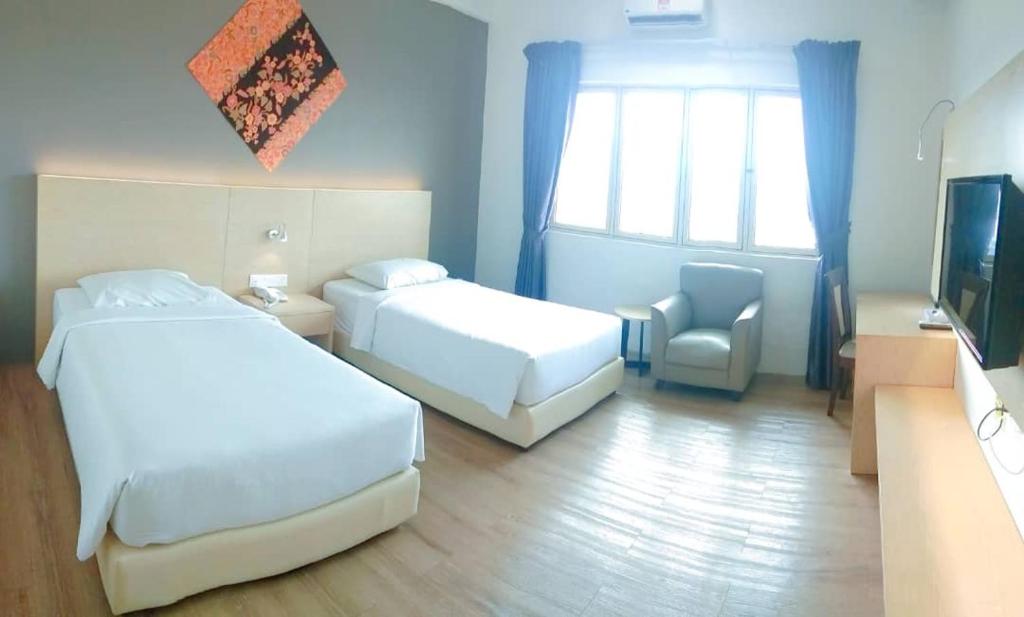 Summit Signature Hotel Batu Pahatにあるベッド