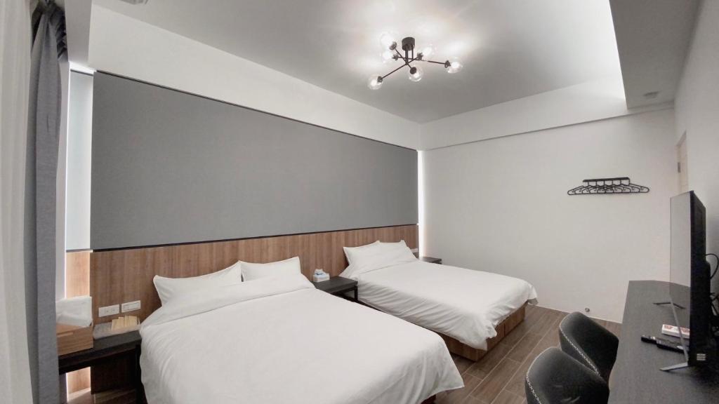 Postel nebo postele na pokoji v ubytování Kimen Yuyu B&B