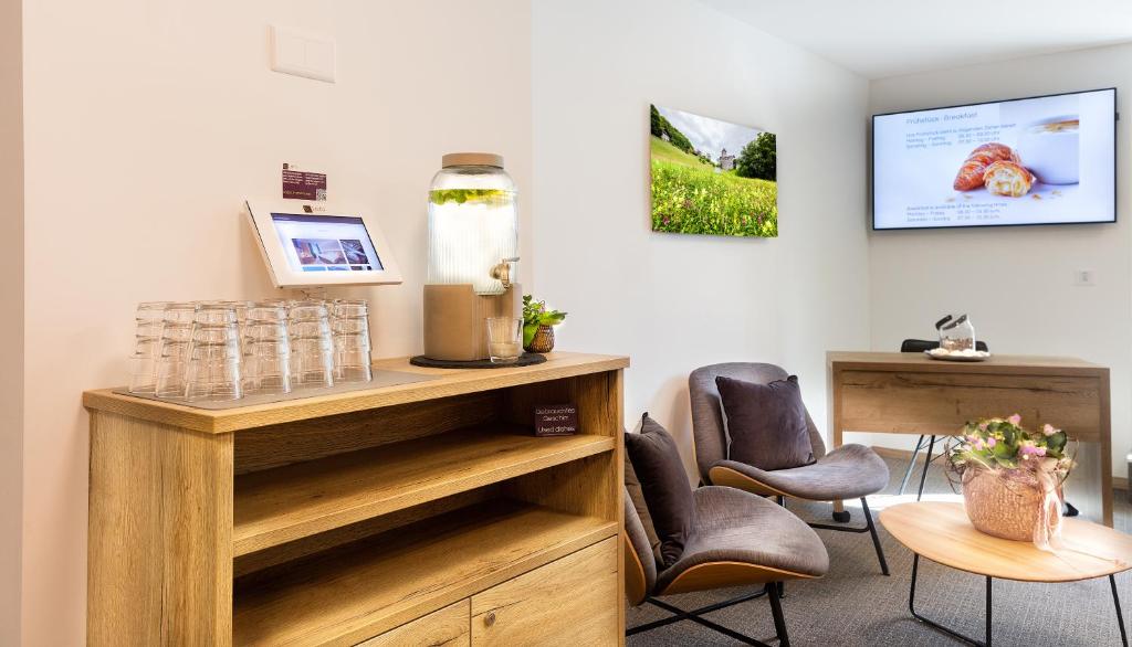 TV a/nebo společenská místnost v ubytování Hotel Vaduzerhof by b-smart