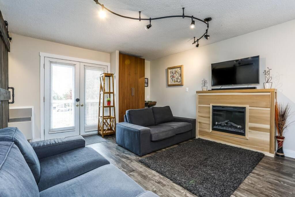 a living room with a couch and a fireplace at Cozy Collingwood Retreat 80204 in Collingwood