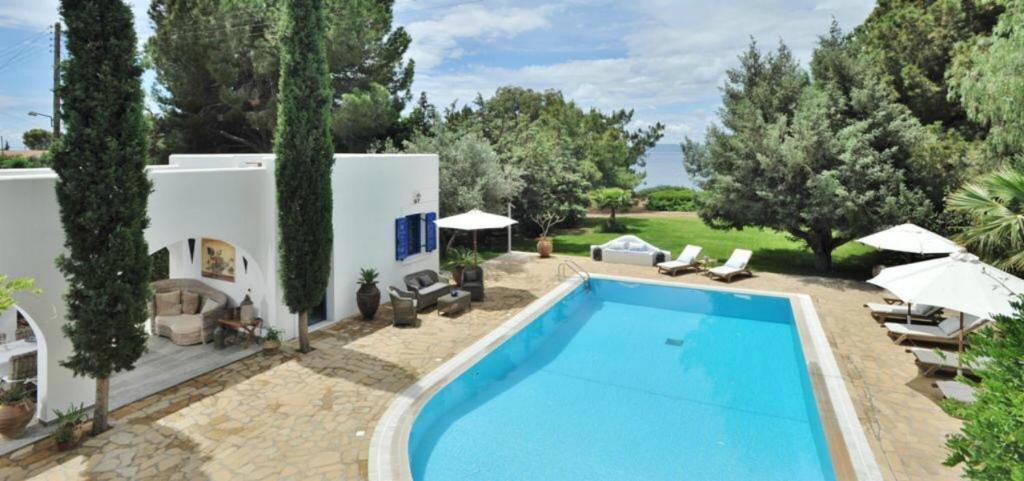 an external view of a villa with a swimming pool at Villa Blue Sapphire in Pefki Rhodes