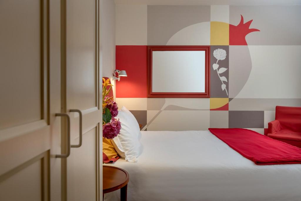 Postel nebo postele na pokoji v ubytování Bijou Hotel