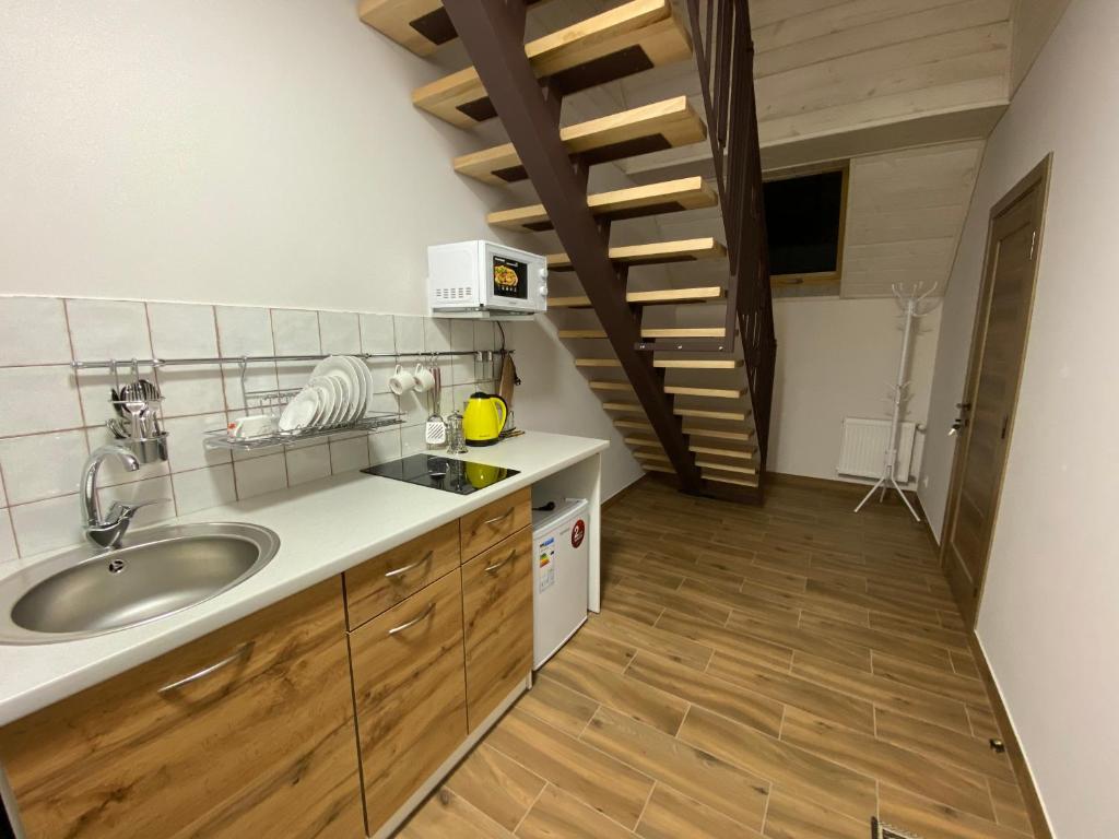 Kuchyň nebo kuchyňský kout v ubytování Вілла Джерело