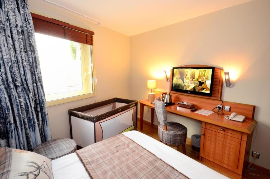 Postel nebo postele na pokoji v ubytování Green hotels Confort Paris 13