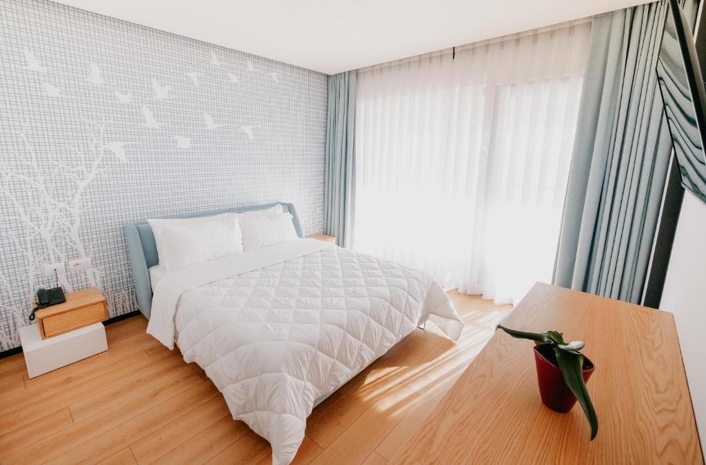 Postel nebo postele na pokoji v ubytování Amara Hotel & SPA