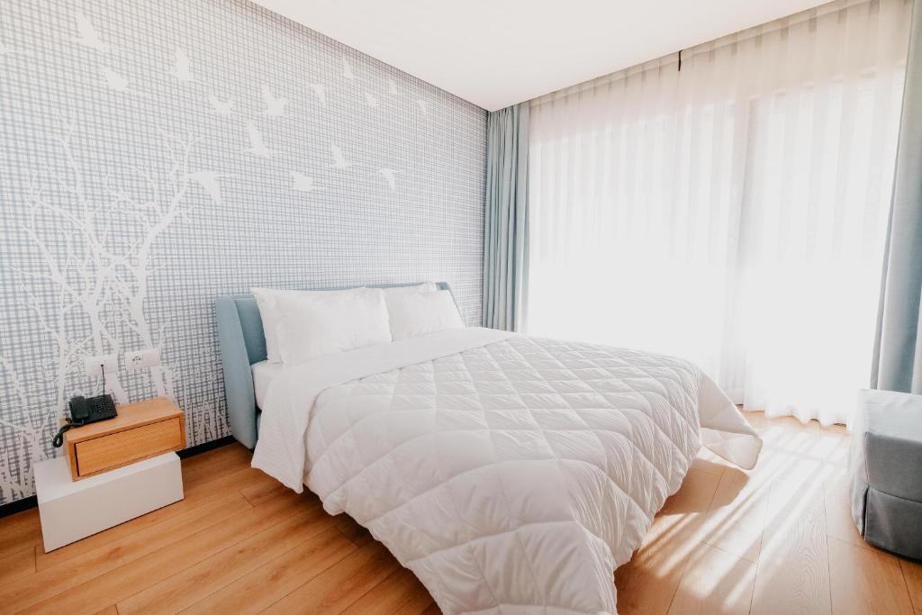 Postel nebo postele na pokoji v ubytování Amara Hotel & SPA