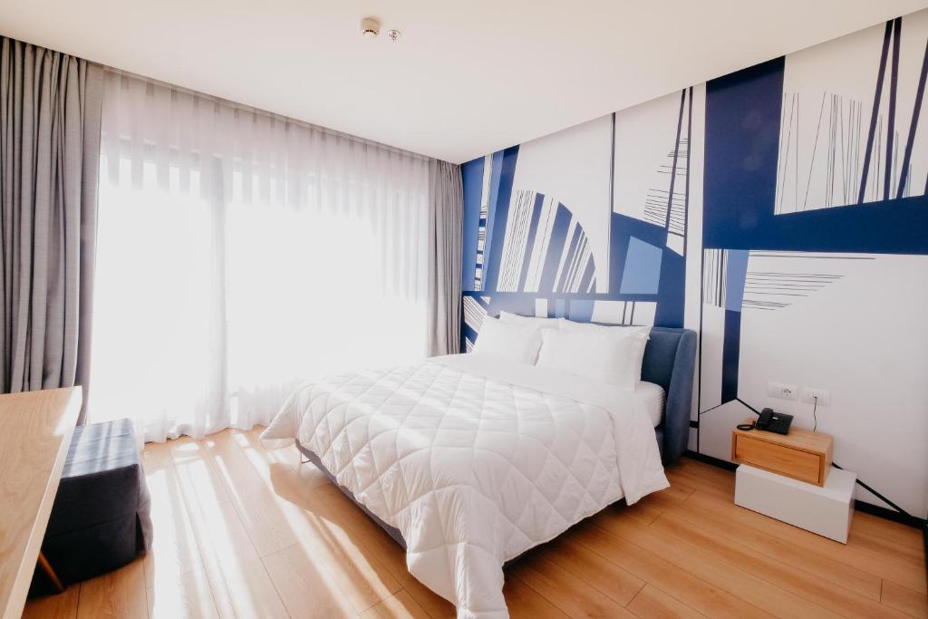 Postel nebo postele na pokoji v ubytování Amara Hotel & SPA