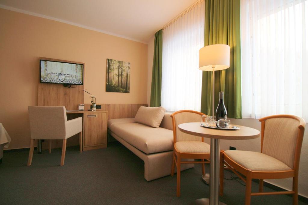 TV a/nebo společenská místnost v ubytování Hotel Harzresidenz