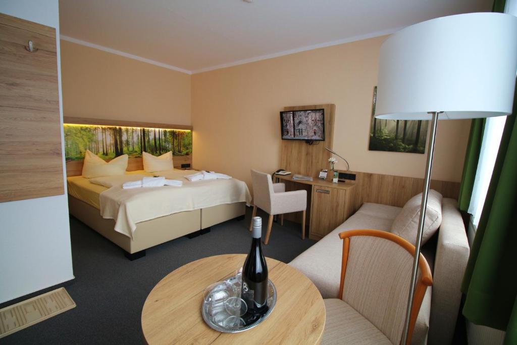 Postel nebo postele na pokoji v ubytování Hotel Harzresidenz