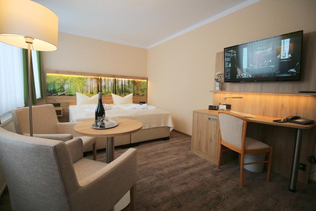 TV a/nebo společenská místnost v ubytování Hotel Harzresidenz