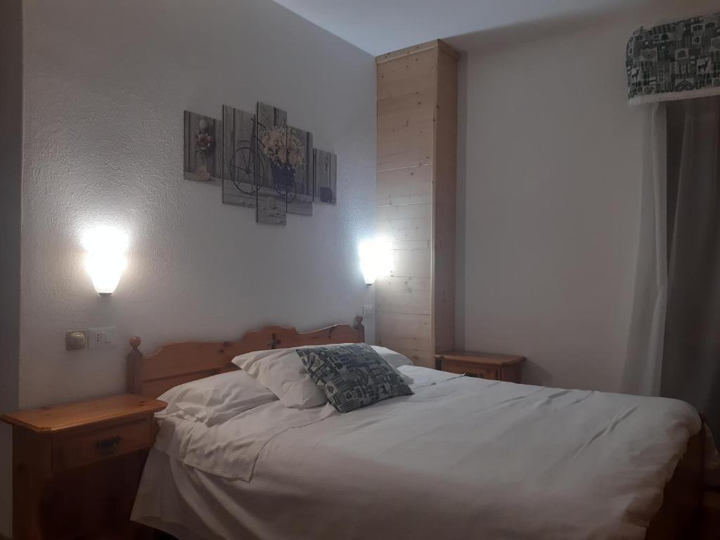 Postel nebo postele na pokoji v ubytování Garnì Valdan