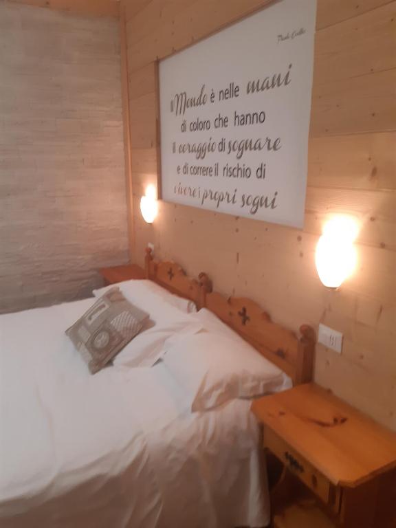 Postel nebo postele na pokoji v ubytování Garnì Valdan