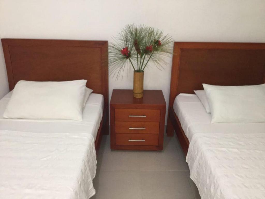 Postel nebo postele na pokoji v ubytování Hotel El Don
