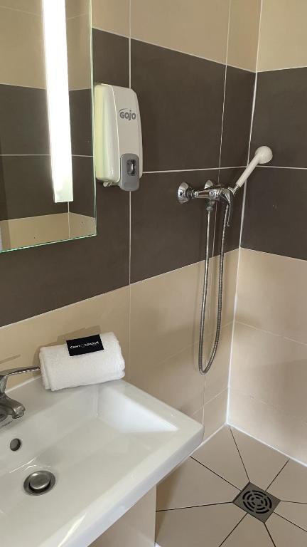 Koupelna v ubytování Hotel Cantosorgue
