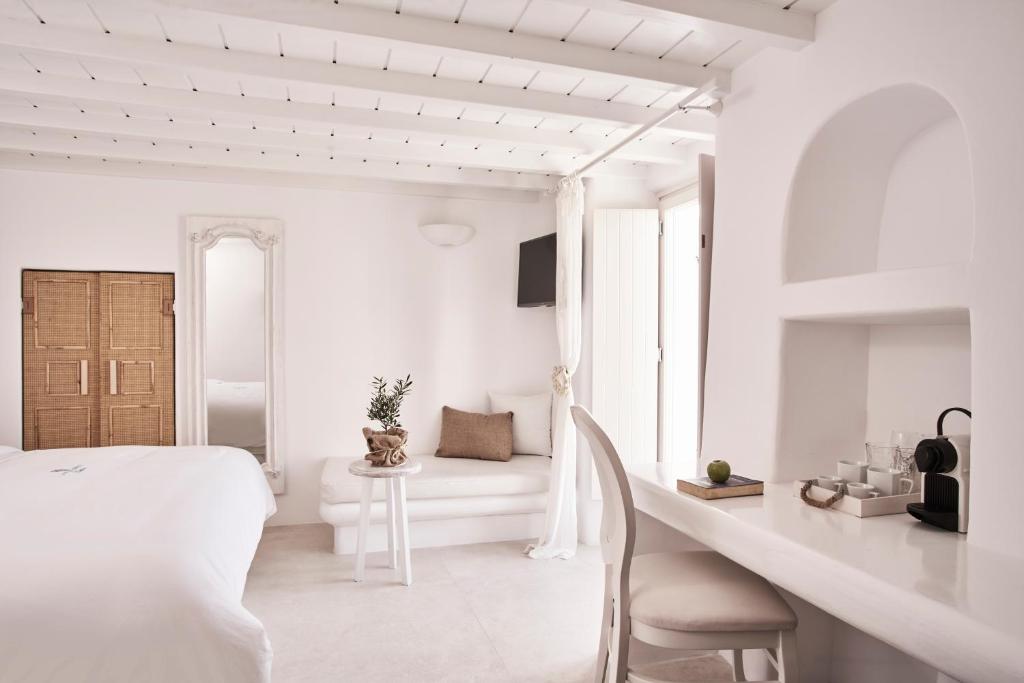 A bed or beds in a room at Little Venice Suites