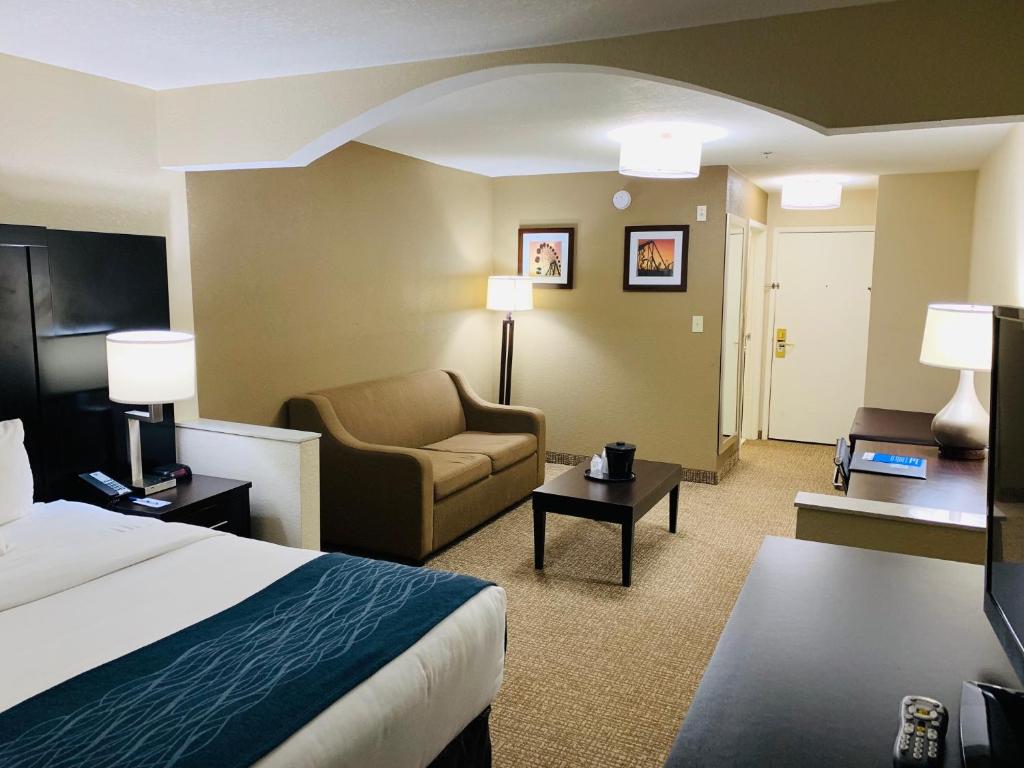 a hotel room with a bed and a chair at Comfort Inn & Suites Atlanta-Smyrna in Atlanta