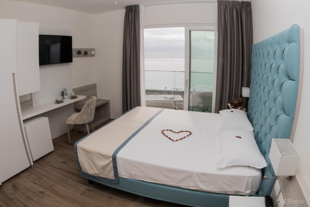Postel nebo postele na pokoji v ubytování Hotel Ariston