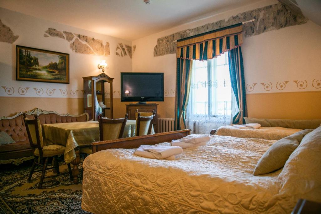 Postel nebo postele na pokoji v ubytování Cantervilla Castle