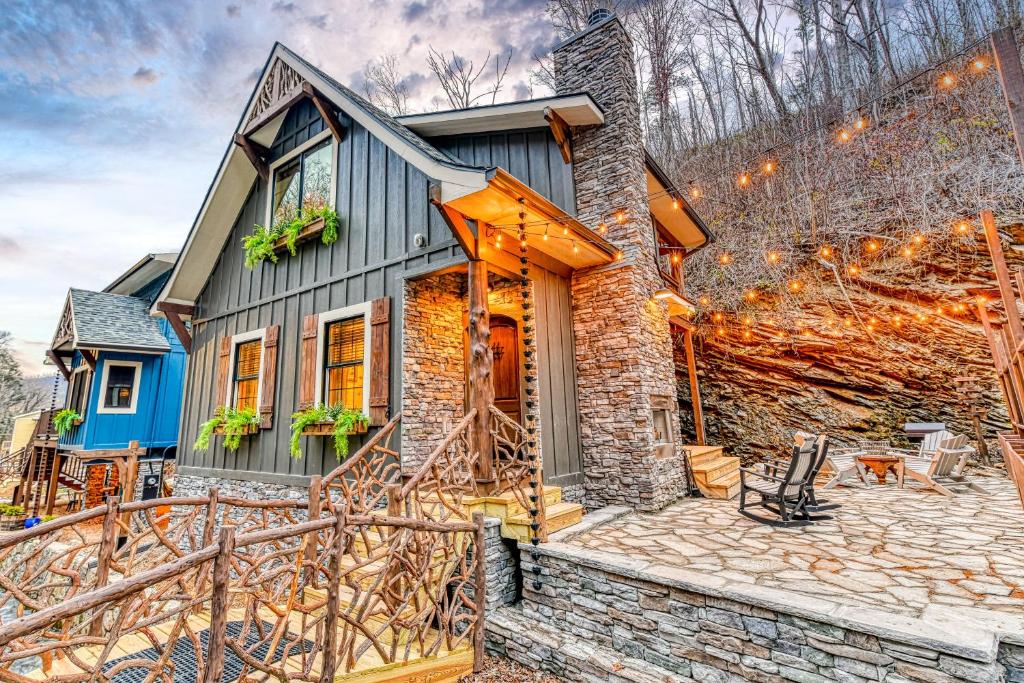 a stone house with a stone path leading up to it at Alpine Creekside Chalet in Gatlinburg