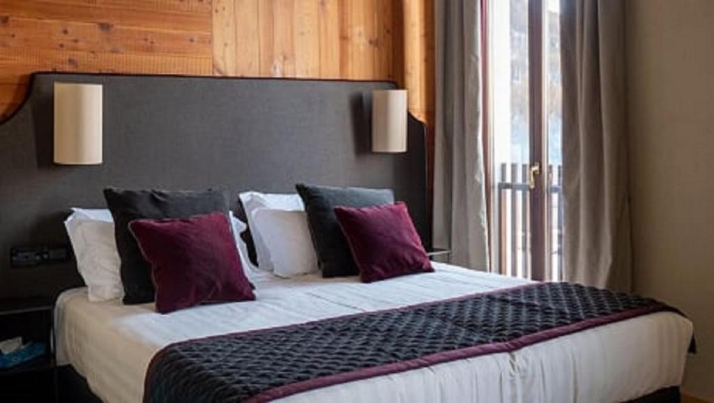 Postel nebo postele na pokoji v ubytování Chaberton Lodge & Spa