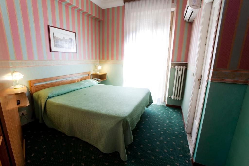 Postel nebo postele na pokoji v ubytování Hotel Adriatic