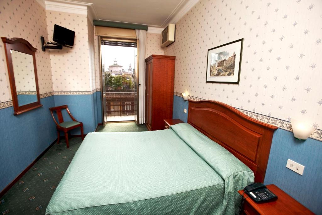 Postel nebo postele na pokoji v ubytování Hotel Adriatic