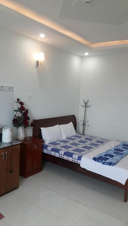 Postel nebo postele na pokoji v ubytování Hotel Khoa Văn