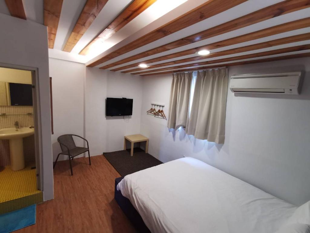 Postel nebo postele na pokoji v ubytování Oasis Inn