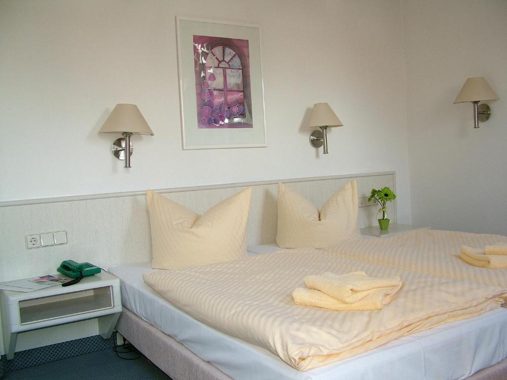 Postel nebo postele na pokoji v ubytování Hotel Fabrice