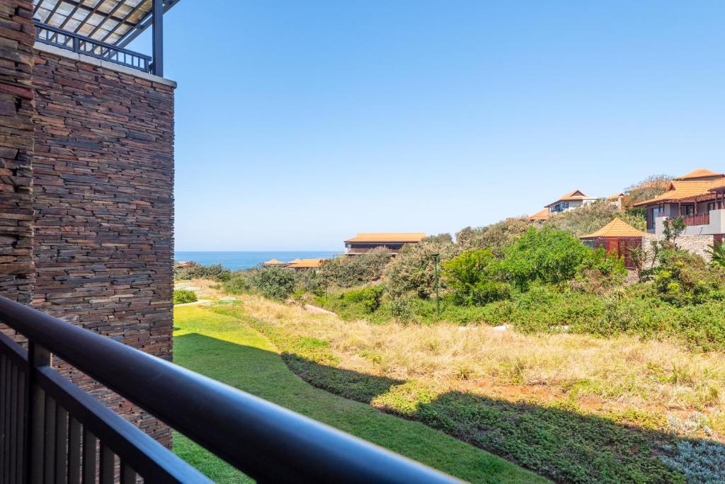 a view from the balcony of a house at Zimbali Suite 214 in Ballito