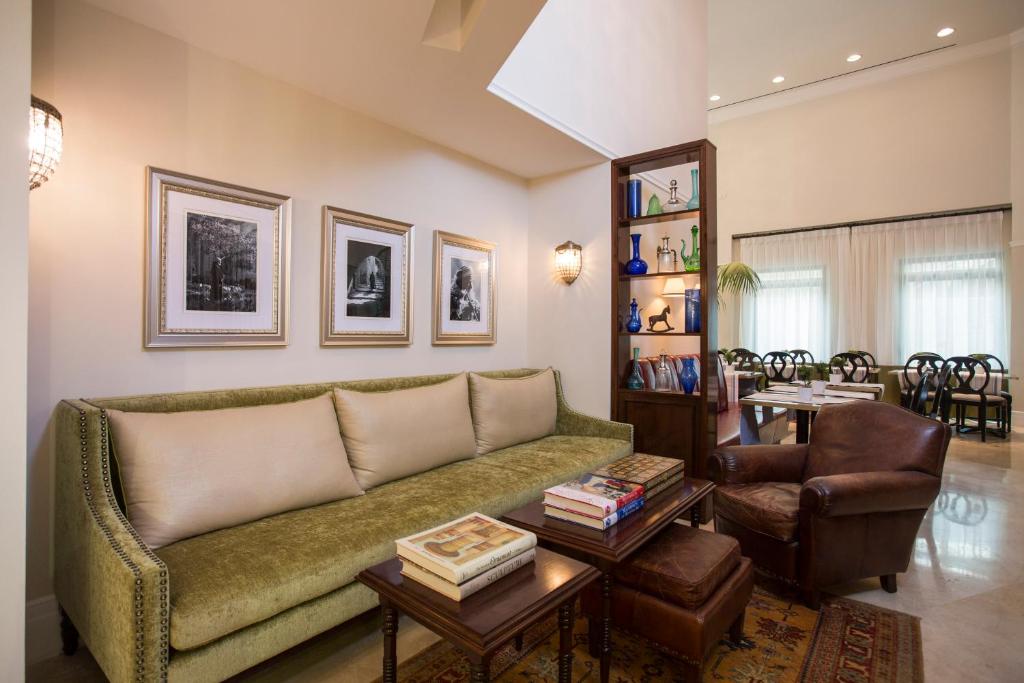 a living room filled with furniture and a couch at Arthur Hotel - an Atlas Boutique Hotel in Jerusalem