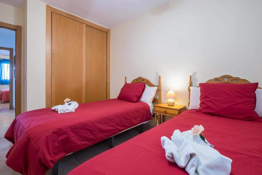 Łóżko lub łóżka w pokoju w obiekcie Apartamento en el Médano
